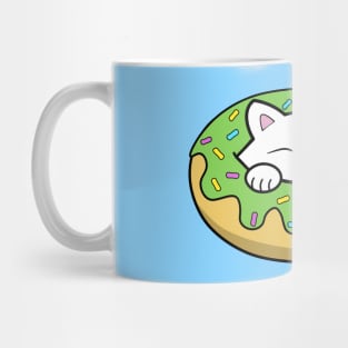 Cute kitten eating a green doughnut with sprinkles on top of it on St. Patrick's day Mug